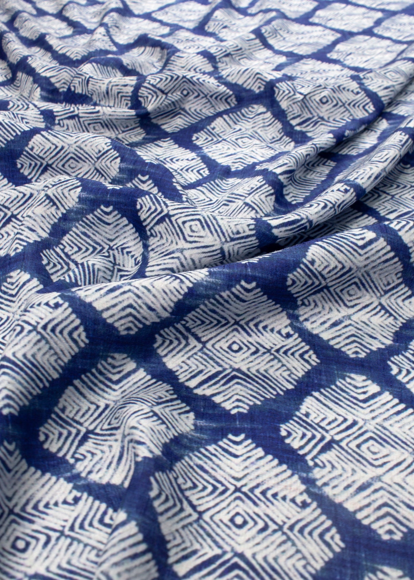 Blue and white patterned fabric with geometric design