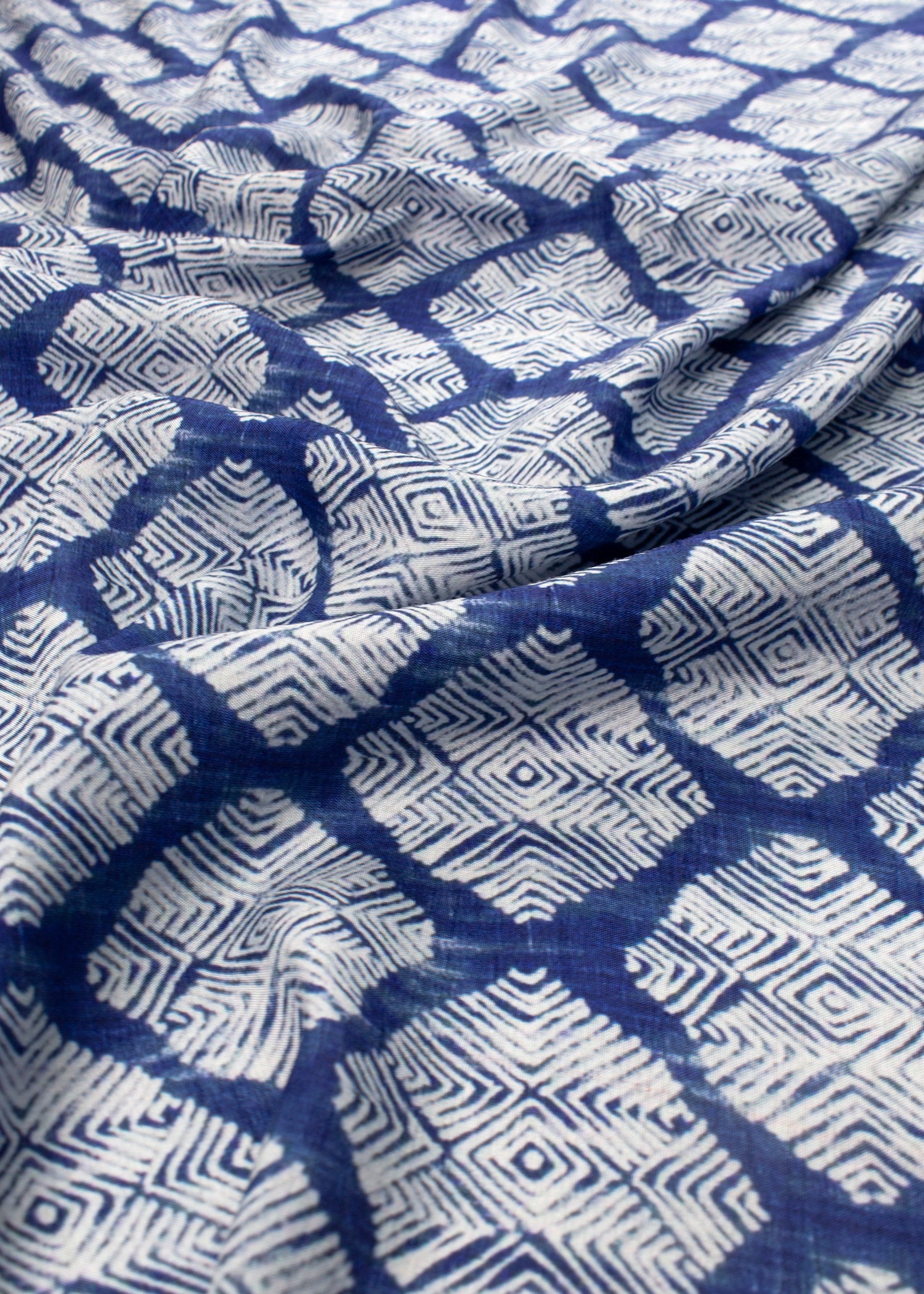 Blue and white patterned fabric with geometric design