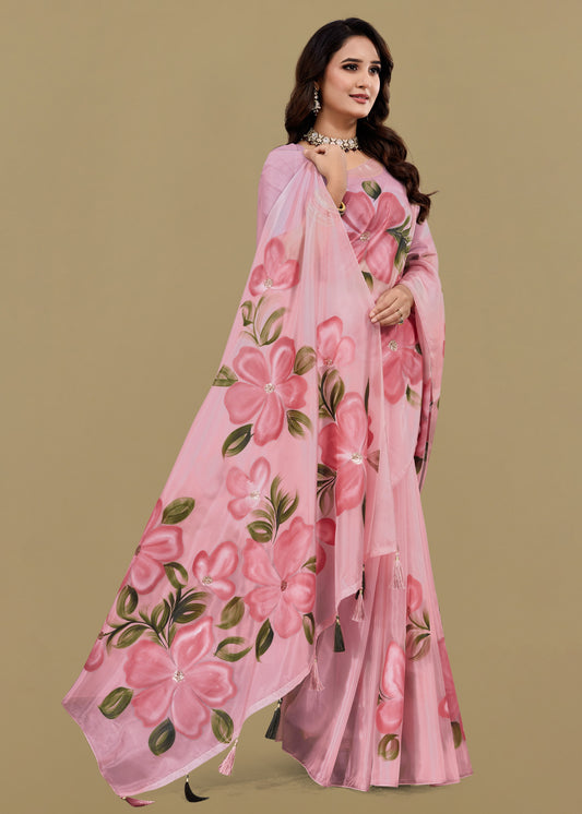Woman wearing a pink floral saree on a beige background