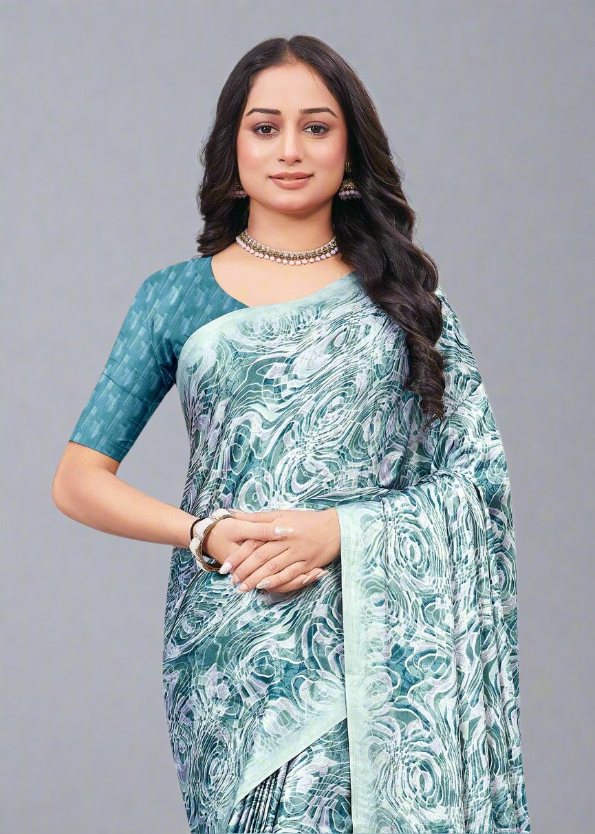 Modern Teal Blue Satin Saree Featuring Dynamic Abstract Patterns