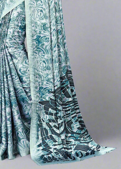 Modern Teal Blue Satin Saree Featuring Dynamic Abstract Patterns